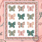 Cover page of a butterfly themed lap quilt pattern in pastel pinks and greens design on a white background, titled 'A Flutter  in France' by Coach House Designs