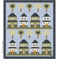 Digital close-up of the lap quilt motif, consisting of 8 quaint green and cream  houses sitting on lines of green grass with lollipop like tree blocks, half of which have blue hearts in them. The remaining trees have a floral pattern. The houses and trees are set on a blue background with a darker blue border.