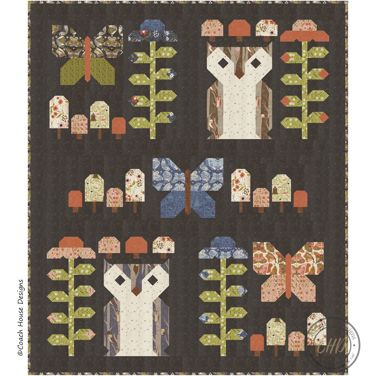 Lap Quilt with owl blocks, flower blocks, mushroom blocks and butterfly butterfly blocks on a dark background