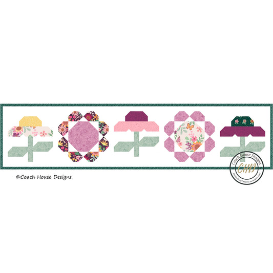 Floral quilt table runner design with colorful flowers on a white background, featuring Coach House Designs logo.